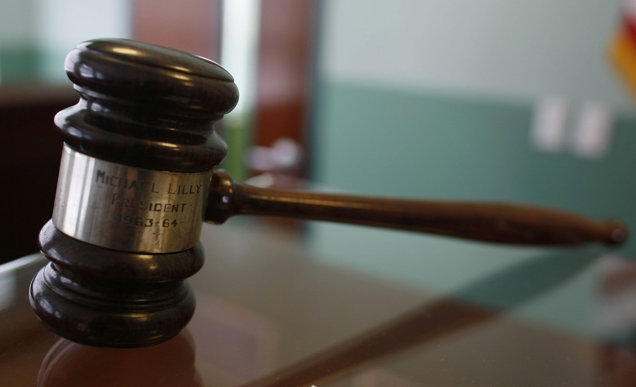 An engraved gavel on a desk