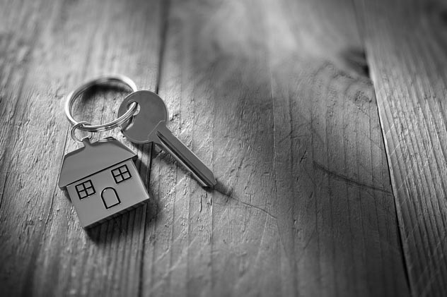 Key with a house-shaped keychain.