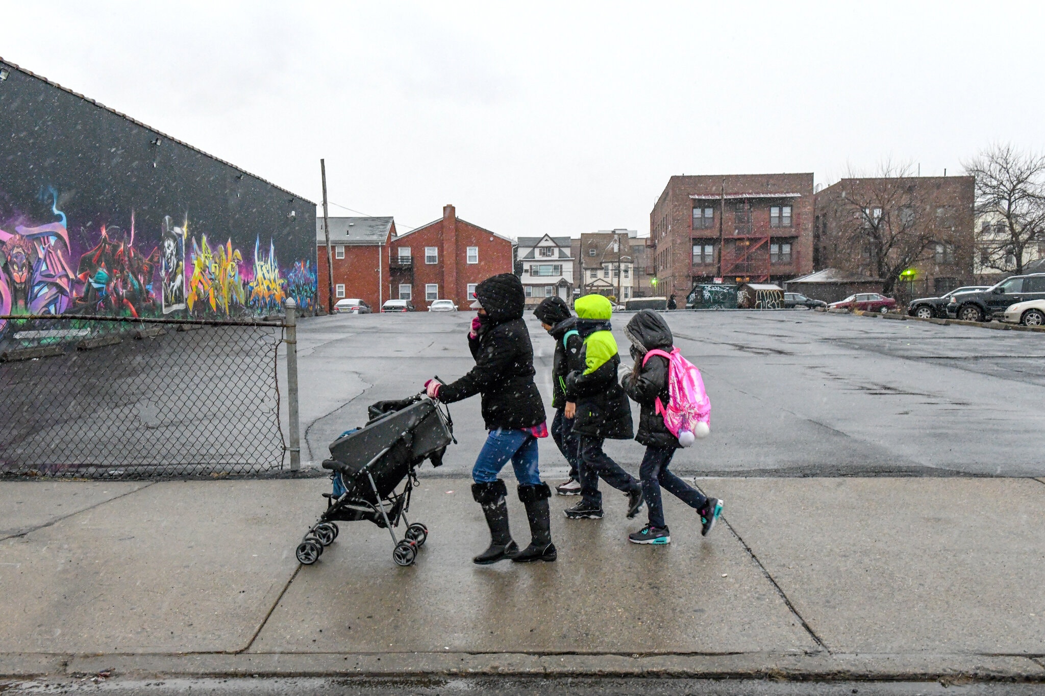 Mother walking with children outdoors