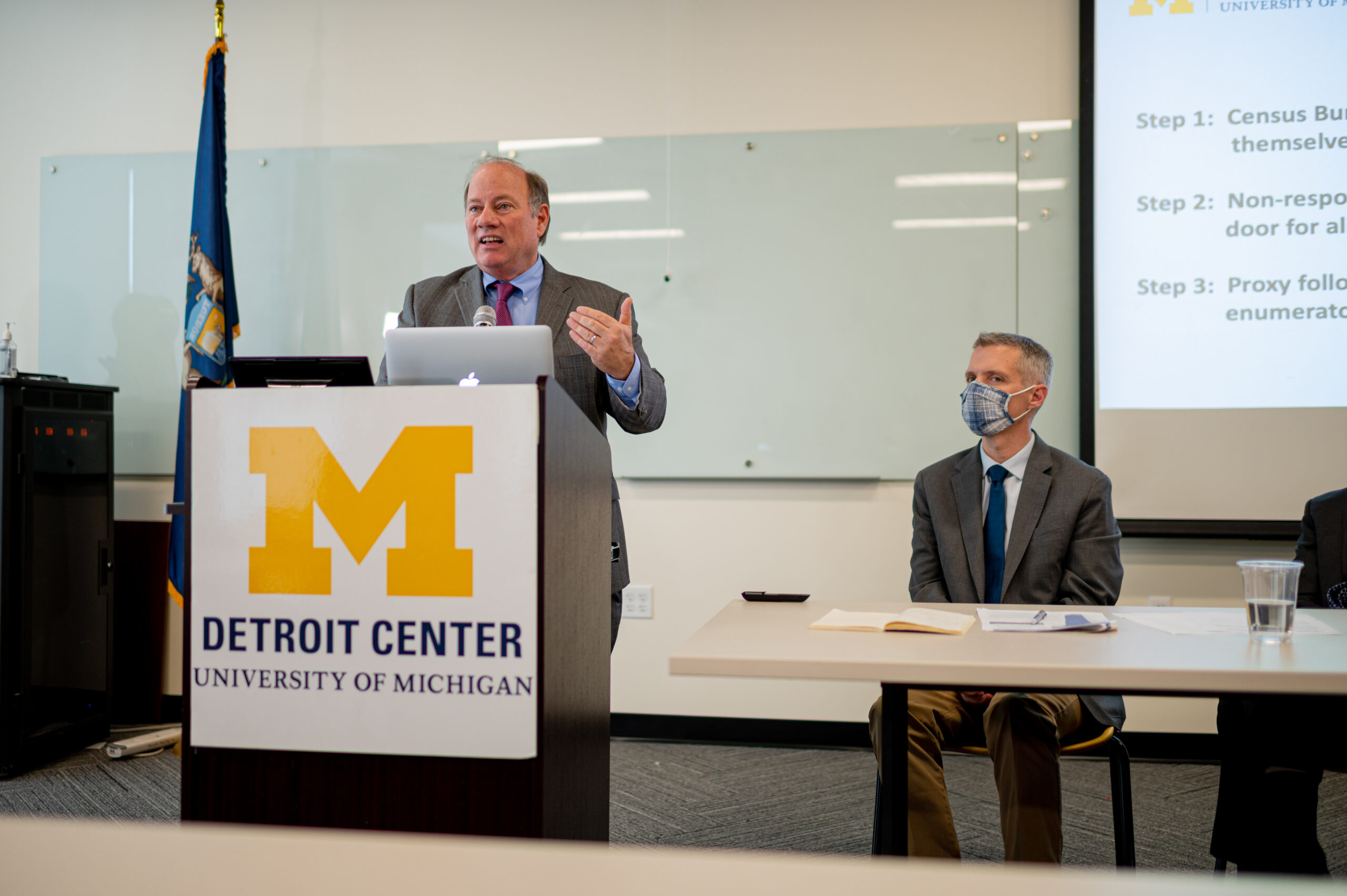 Detroit Mayor Mike Duggan talks about a U-M report that finds the census undercounted Detroit residents by 8% at the U-M Detroit Center. Luke Shaefer, director of Poverty Solutions, sits at right. Credit: Eric Bronson, Michigan Photography.