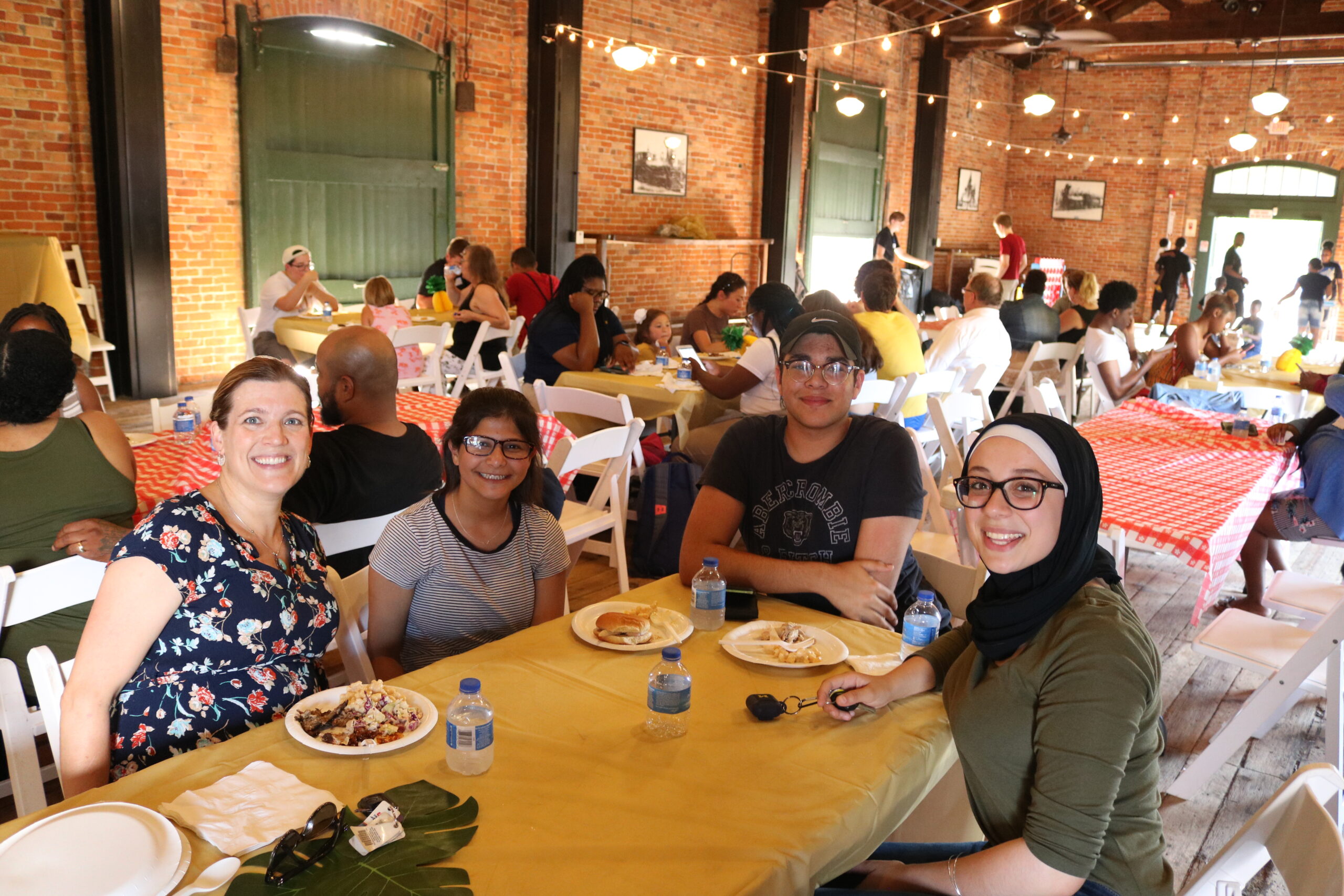 SummerWorks participants gather for a mid-summer celebration at the Ypsilanti Freighthouse in 2019.