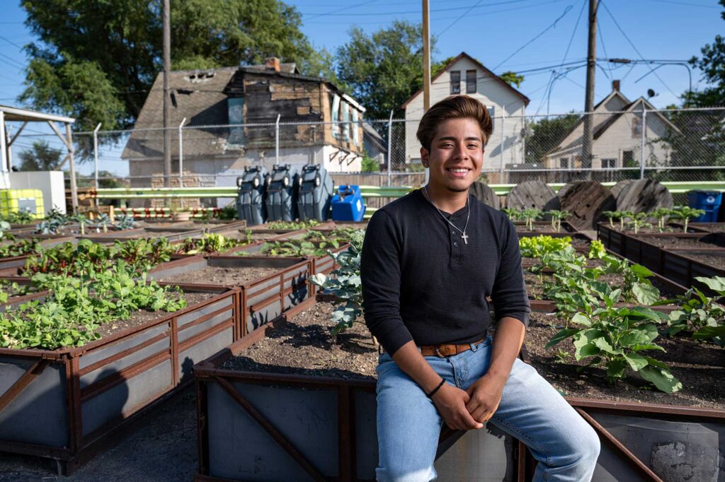 Yahir Hernandez, 19, started working at Cadillac Urban Gardens on Merritt four summers ago. He’s now a sophomore at Michigan State University. Image credit: Eric Bronson, Michigan Photography