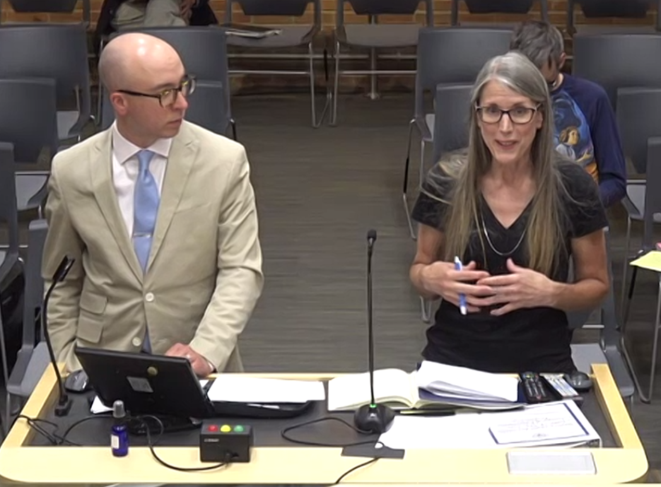 Ann Arbor Deputy City Administrator John Fournier (left) and U-M Poverty Solutions Associate Director Kristin Seefeldt address city council about the guaraneed income proposal at a meeting on June 5, 2023.