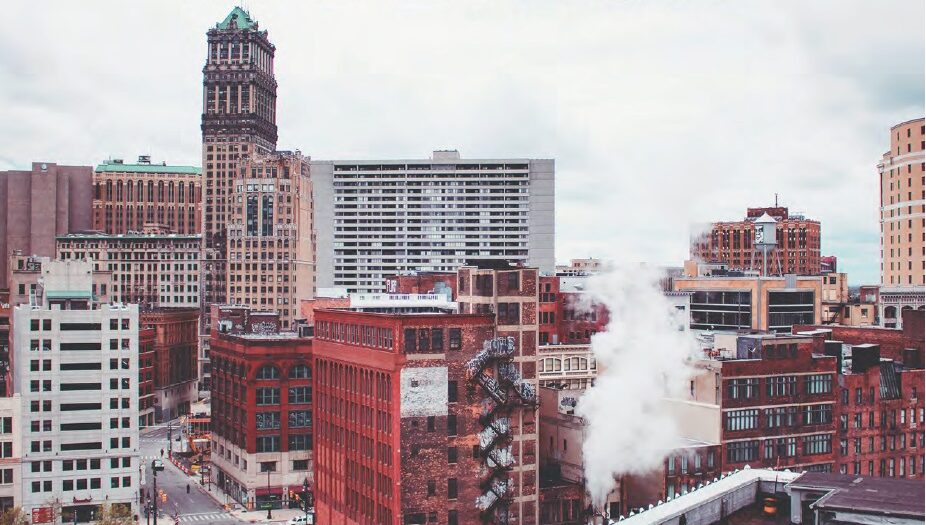 View of downtown Detroit with smoke rising from a building.