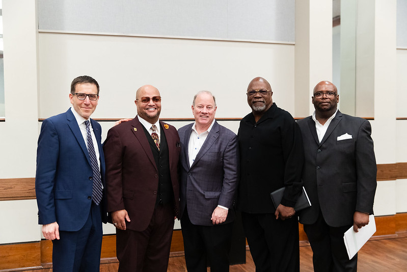 University of Michigan Professor Jeffrey Morenoff (left) stands with Detroit Mayor Mike Duggan (center) and other speakers at a press conference on April 16, 2024, about Morenoff's findings on how Detroit home values changed from 2014 to 2022. (Photo...