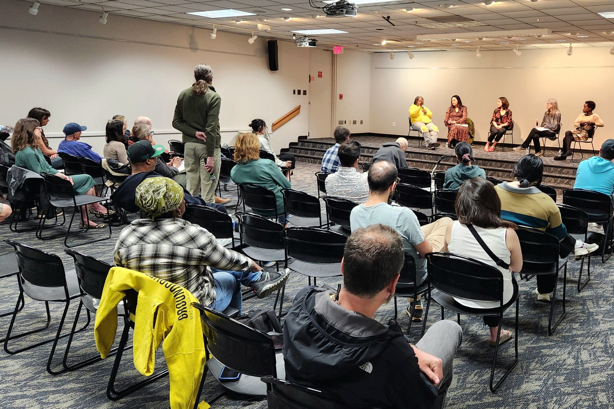 Wide view of a community conversation on Guaranteed Income to Grow Ann Arbor, held May 8, 2025 at the downtown Ann Arbor library, showing attendees seated throughout the room.