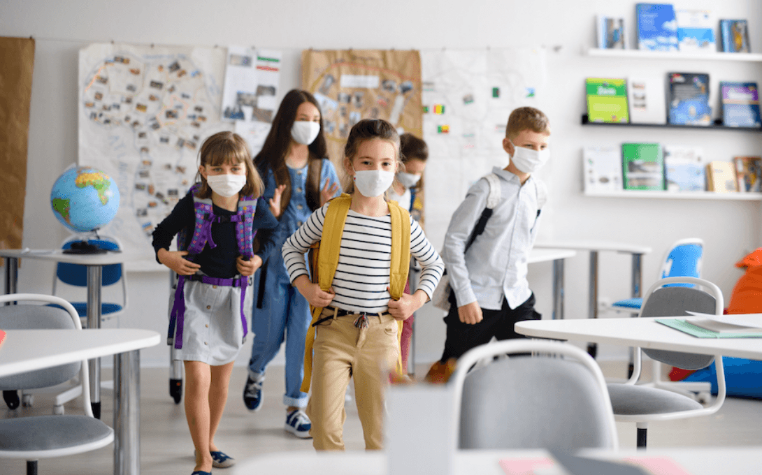 school kids in masks during the pandemic